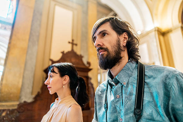 An orthodox priest reading a prayer during christening in an Orthodox church.