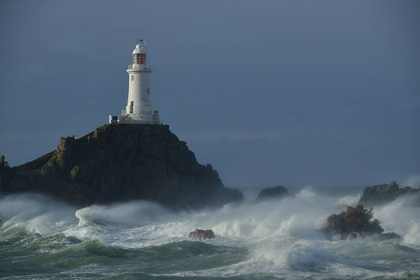 Coastal lighthouse in the Winter and storm Ingrid.