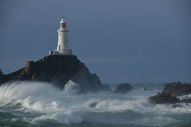 Coastal lighthouse in the Winter and storm Ingrid.