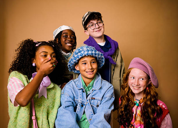 Diverse group of elementary age friends happily posing for a portrait