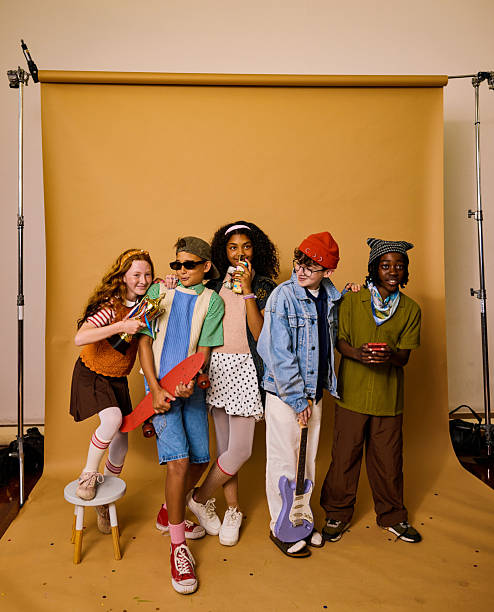 Multiracial children standing together in a studio, celebrating friendship and creativity