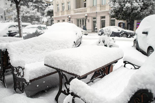 Outdoor bench in the snow in the park, Moscow