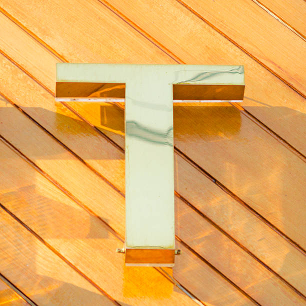 Golden  colored letter T