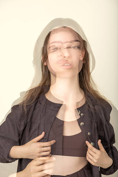 Woman overlaying multiple faces and movements creates a conceptual portrait