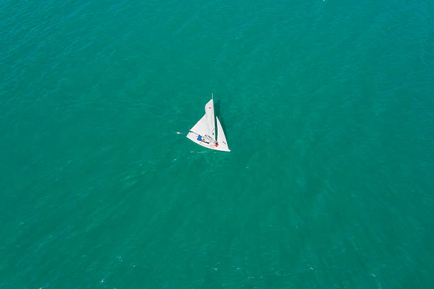 sailboat models on beige background in room interior