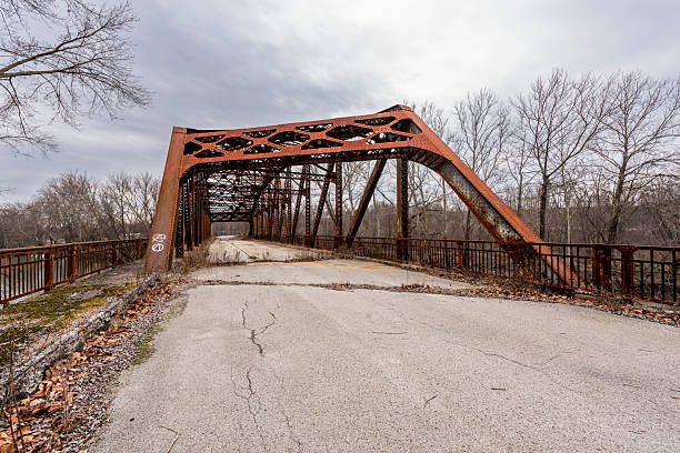 The rusting steel Willow Grove Bridge carried Pennsylvania Route 18 across the Mahoning River near the Mahoningtown section of New Castle, Pennsylvania. Beneath a cloudy sky, bare trees and the bridge’s weathered structure gave the scene a forlorn, wintery appearance.