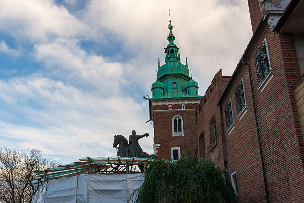 Krakow, Poland – October 25, 2025: The equestrian statue of Tadeusz Kosciuszko stands in the Wawel Castle courtyard during renovation works. Scaffolding surrounds part of the monument, highlighting conservation efforts at the historic royal complex.