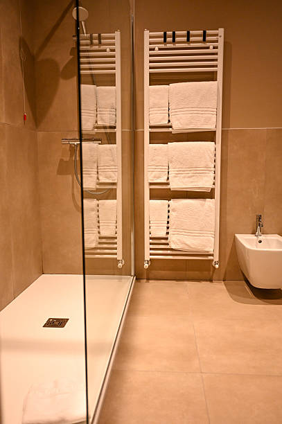 Bathroom with white towels and toilet clean home comfort
