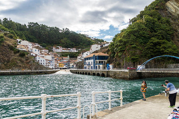 Cudillero, Asturias, Spain, September 14, 2025;Tourists stroll through the picturesque coastal village on the Cantabrian coast,a famous fishing village.