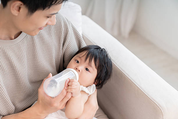 istock asian father and baby,baby formula 2258028466