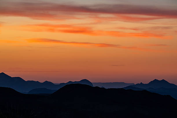 Orange Sky Blankets The Silhouetted Ridges Of Big Bend National Park