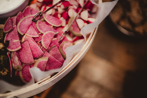 Watermelon radish sliced on tray at party wedding reception