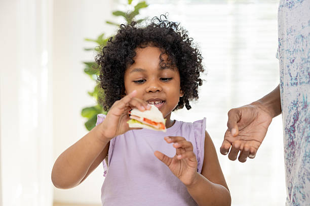 Child Enjoying a Fresh Homemade Sandwich