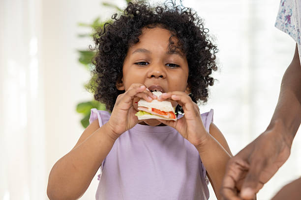 Child Enjoying a Fresh Homemade Sandwich