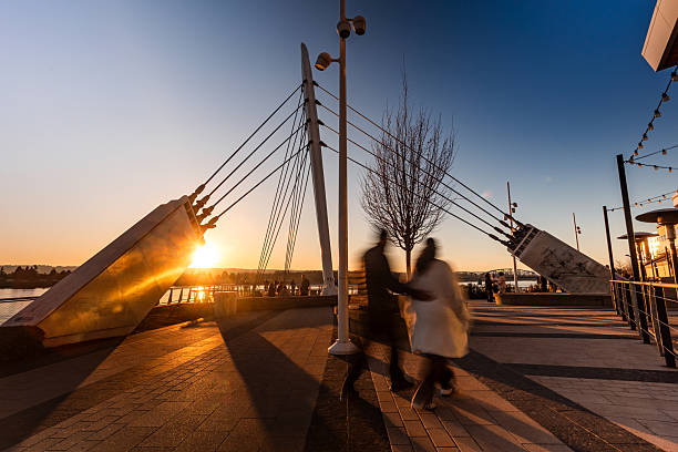 The Vancouver Washington Waterfront Park At Twilight, shot with a ND filter to slow the shutter speed and blur the people visiting the park. This is a popular location to visit in Vancouver, Washington, and the pier overlooks the Columbia River.