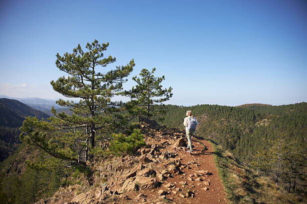 Young woman hiking mountain.