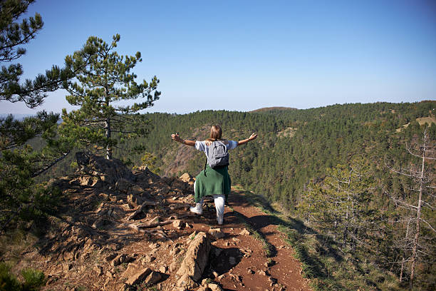 Young woman hiking mountain.