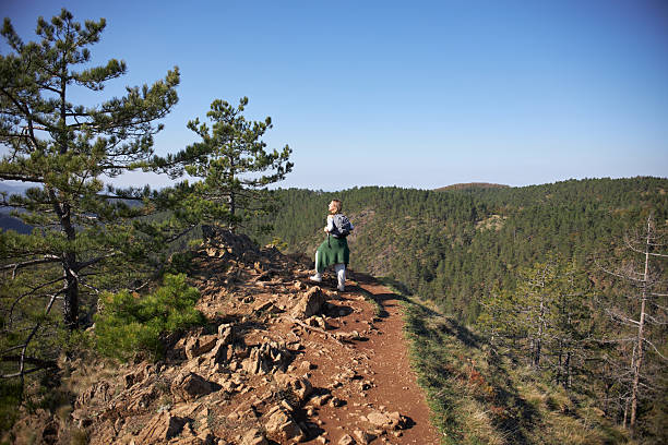 Young woman hiking mountain.
