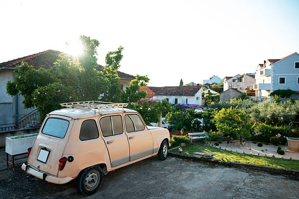 Warsaw, Poland - September 13, 2023: There is a narrow street next to the houses and there are cars parked on both sides of the street in Saska Kepa housing estate, part of the Praga-Poludnie district