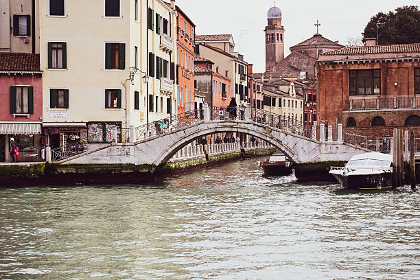 Gorgeous cityscape of Venice with narrow canals, boats and gondolas and bridges with traditional Colorful  buildings. Location: Venice, Veneto region, Italy, Europe