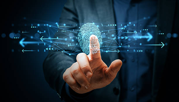 Man in business suit using fingerprint on glowing holographic interface, futuristic blue light background, concept of secure tech data access