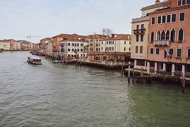 Gorgeous cityscape of Venice with narrow canals, boats and gondolas and bridges with traditional Colorful  buildings. Location: Venice, Veneto region, Italy, Europe