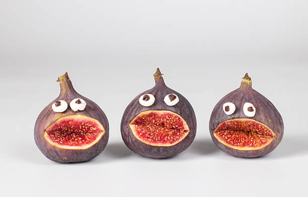 Spooky fig monsters for Halloween on white background