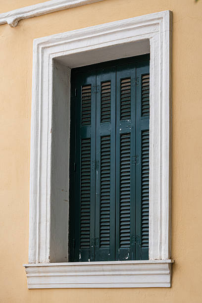 Wooden shutters on the windows of old houses in the old part of Athens, Plaka