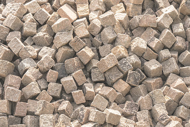 Natural stone paving cubes stacked in a large pile