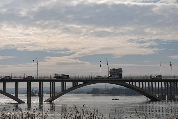 Suspension bridge over the river and vehicle passage.