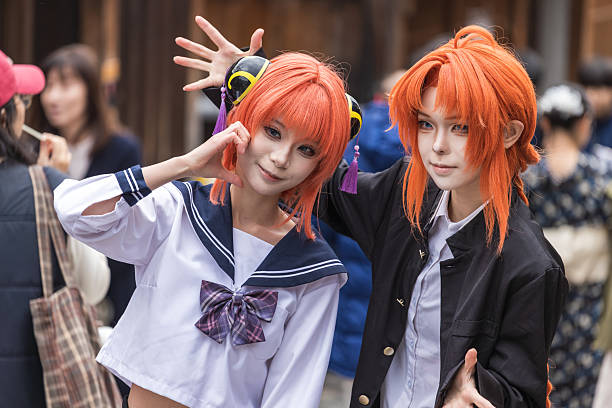 Montreal, Canada - July 5, 2024. Young people posing on street in Chinatown with Comiccon costume, Montreal, Quebec, Canada