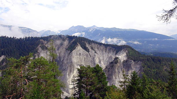 The Swiss Grand Canyon, officially known as Ruinaulta, remains one of the most breathtaking natural treasures of the canton of Graubünden. It is a monumental gorge carved by the Vorderrhine River through thick white cliffs. The canyon is famous for its vertical walls of snow-white limestone, reaching heights of up to 400 meters. In summer, this \