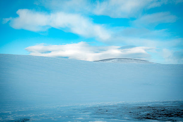 low snowy slope and cloud