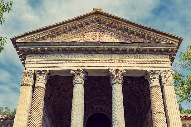 Ornate pediment and Corinthian columns on the historic Temple of Clitumnus, Campello sul Clitunno