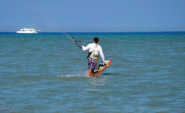 Cabedelo, Viana do Castelo, Portugal - August 21, 2025: Variety of surfing activity on the Atlantic Ocean beach, kitesurfing, windsurfing