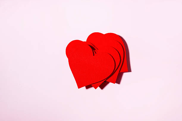 istock Stack Of Red Hearts On Soft Pink Background With Copy Space 2258102271