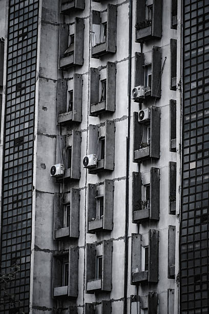 Black and white architectural composition highlighting geometric patterns on a brutalist apartment building in Belgrade, Serbia