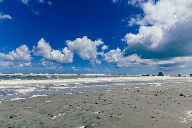 Waves crash near stones under bright atmosphere surf seascape coastline shore