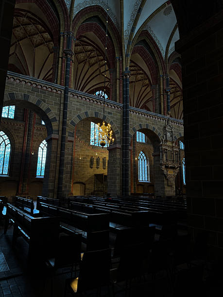 Munich, Germany - Dec 21, 2023 - Interior architecture view of St. Michael's Church (Michaelskirche Jesuit church) in Munich pedestrian zone. It is the largest Renaissance church north of the Alps. Space for text, Selective focus.