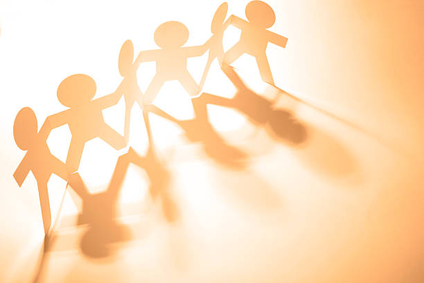 A human paper chain, demonstrating a family or togetherness concept.