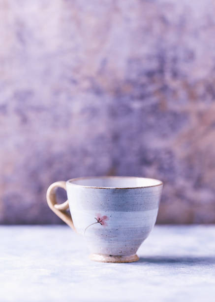 Traditional japanese ceramic on rustic wooden background. Soft focus. Copy space.
