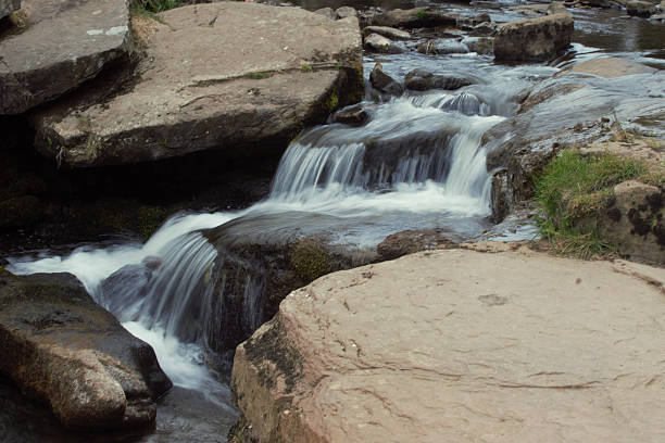 A long exposure image of a small waterfall at Three Shires Head, we're the counties of Cheshire, Derbyshire and Staffordshire meet in the peak district.