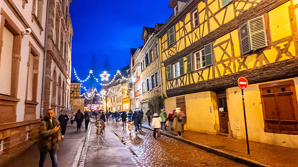 Colmar, France - December 10, 2025: Old town of Colmar, Alsace, France. Petite Venice, water canal and traditional half timbered houses. View with colorful buildings at blue hours.