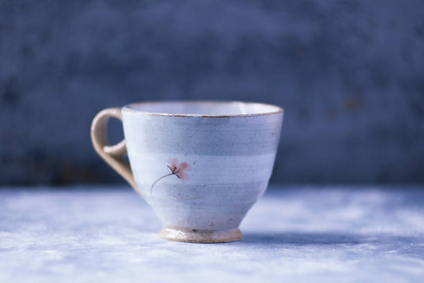 Traditional japanese ceramic on rustic wooden background. Soft focus. Copy space.