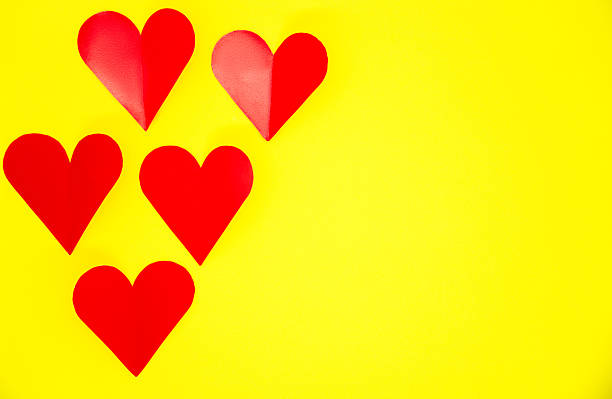 Heart Shaped Red Papers On Yellow Background