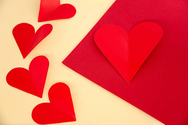 Heart Shaped Red Papers On Yellow Background