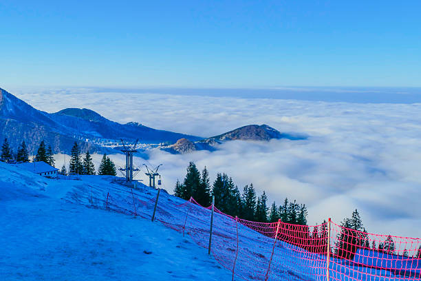 Scenic landscape with ski slope at Swiss ski resort Flumserberg on a foggy late winter day. Photo taken March 16th, 2025, Flumserberg, Switzerland.
