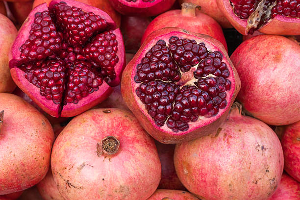 istock Fresh pomegranates on display at local market during afternoon 2258164118