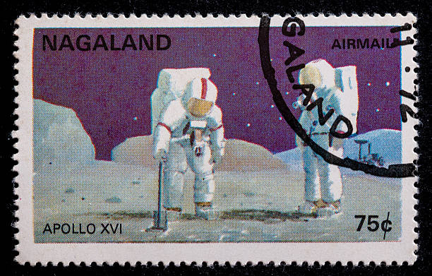 Postage stamp from  Nagaland, India, 1972, Apollo XVI astronauts on the moon surface with their lunar rover in the background.