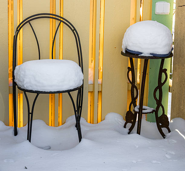 Picnic set in winter on a barnwall, frosty, glistering